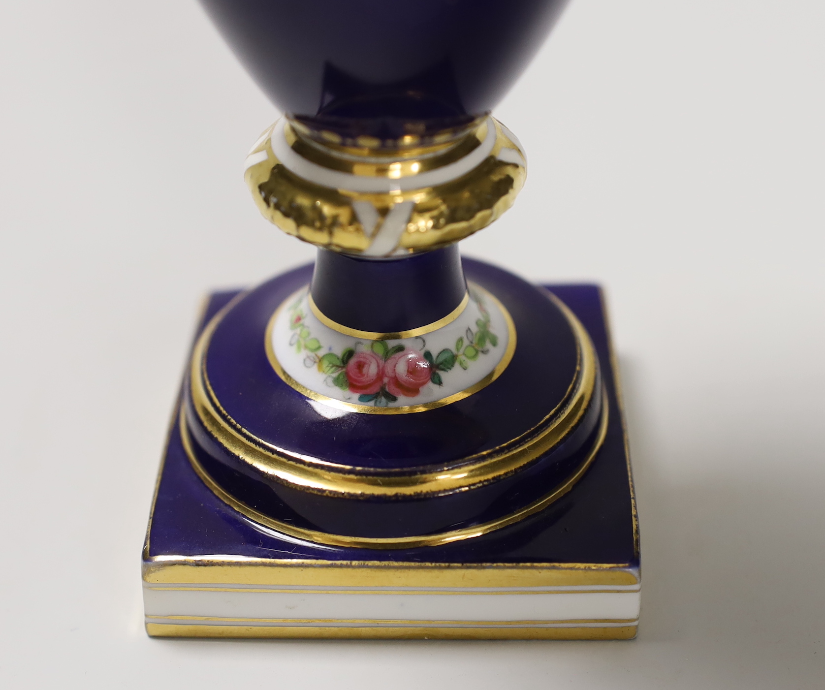 A Minton two handled vase painted with portrait medallions on a blue and gilt ground, 28cm high